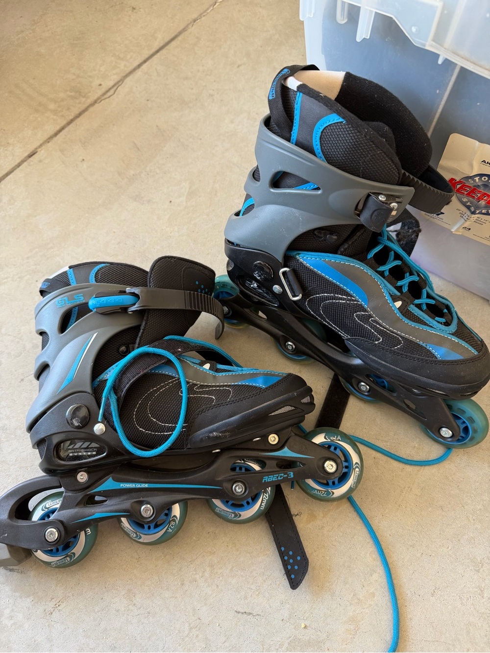 Adjustable Black and Teal Inline Skates